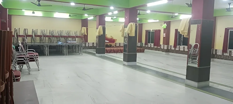 Full marriage hall interior view showing lighting and decoration at ARATI KUNJA